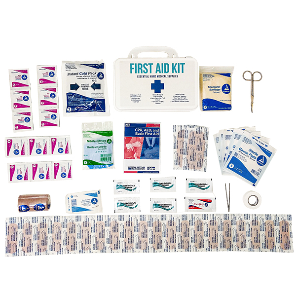 Supplier photograph of Standard Home First Aid Kit contents arranged beside its case