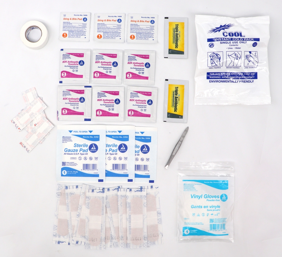 Supplier photograph showing the Compact First Aid Kit supplies laid out